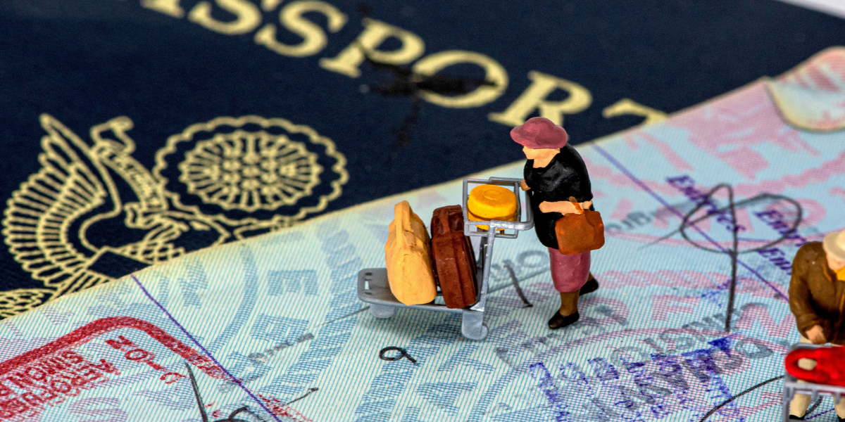 Image of a passport with 3D figure pushing a suitcase trolley, meant to signify a UK Permanent Resident freely travelling in and out the country